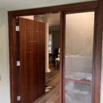 New stained wood entry door with frosted glass sidelight installed in Los Angeles