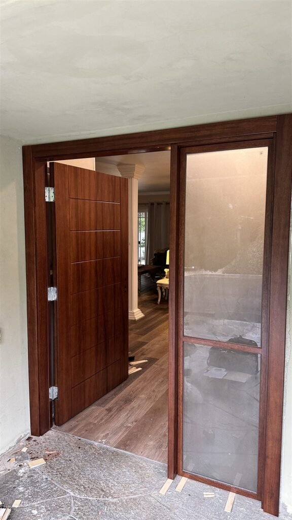 New stained wood entry door with frosted glass sidelight installed in Los Angeles