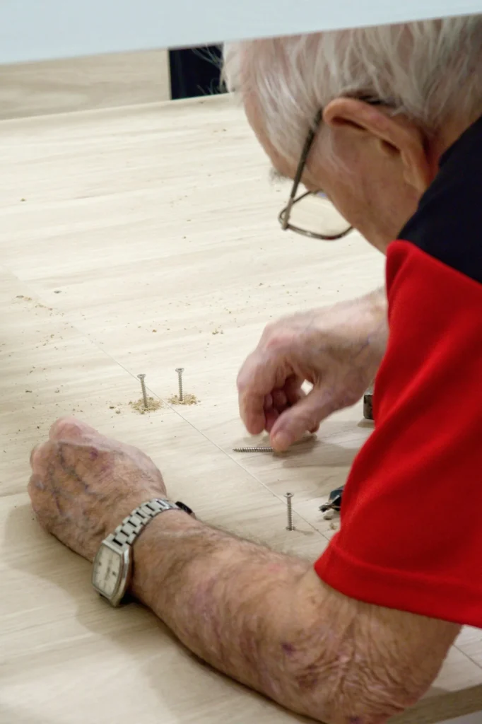 Hand finishing door hardware after a repair in Los Angeles