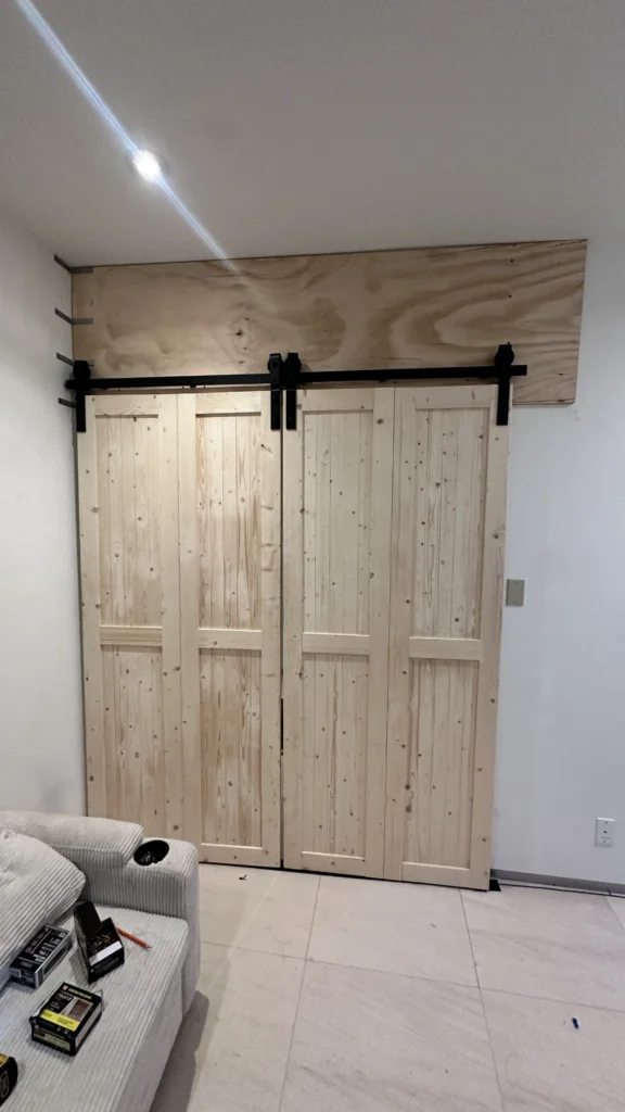 Wood sliding barn door installed in a Los Angeles bathroom