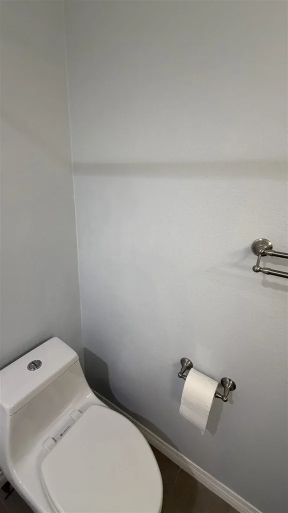 Bathroom with new toilet and towel bar in Los Angeles