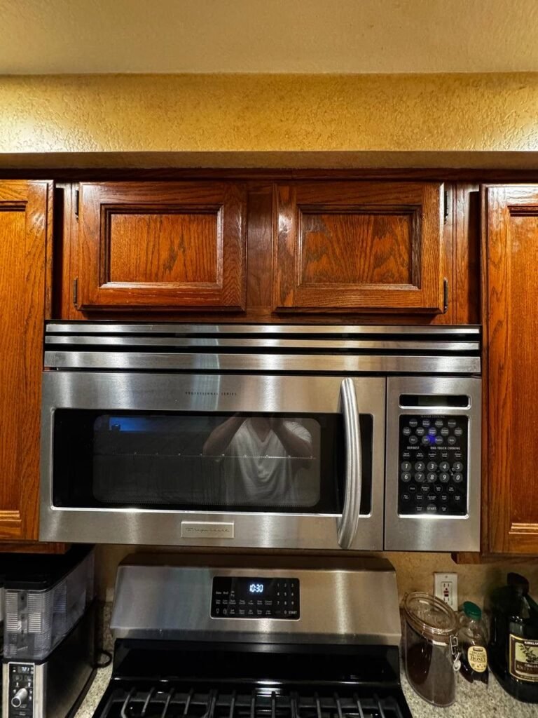 Wood kitchen cabinets and microwave in Los Angeles