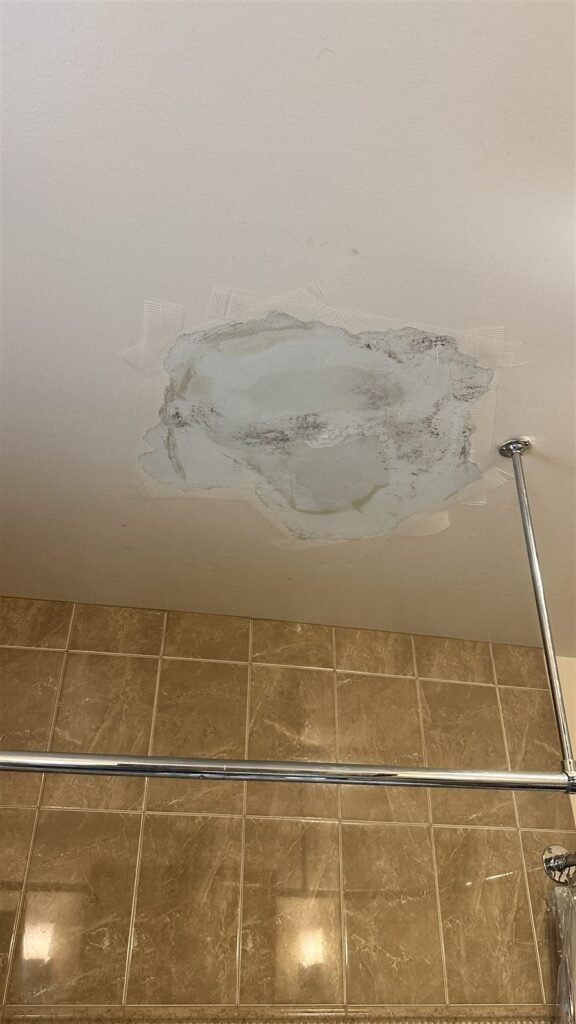 Ceiling water stain patched in a Los Angeles bathroom