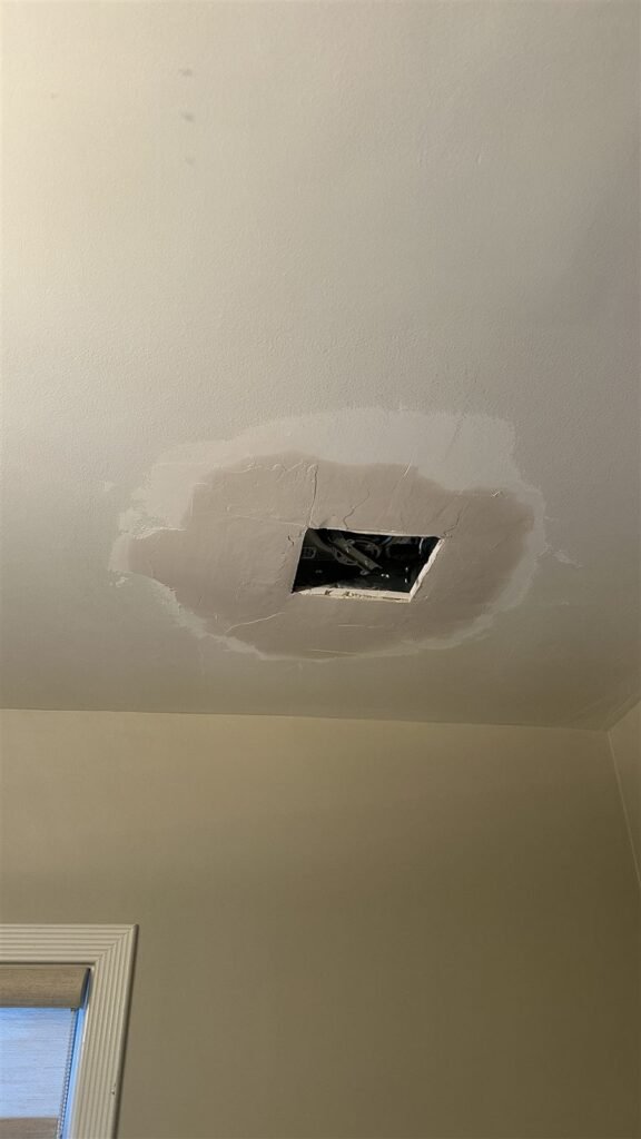 Ceiling hole cut for a repair in Los Angeles