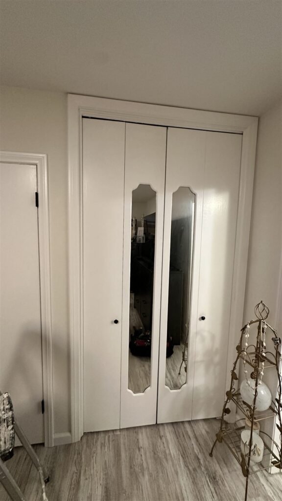 Bifold closet doors with mirrored glass panels in Los Angeles