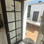 Black-framed glass door installed in a Los Angeles home