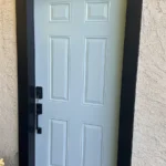 New light blue exterior door with black trim installed in Los Angeles