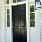 Black front entry door with transom windows installed and painted in Los Angeles