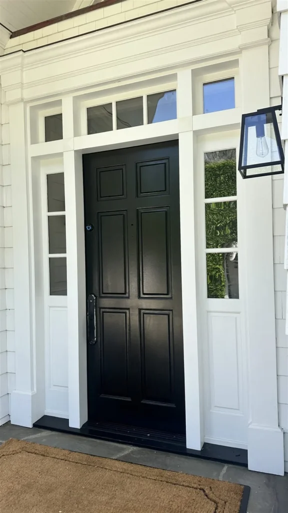 Black front entry door with transom windows installed and painted in Los Angeles