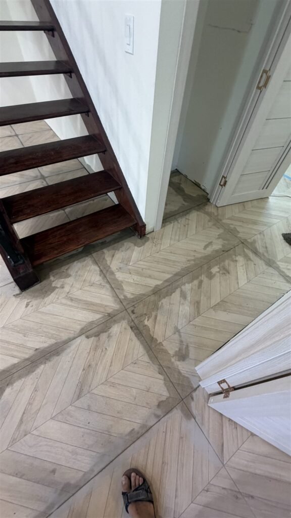 Herringbone tile floor near a staircase in Los Angeles