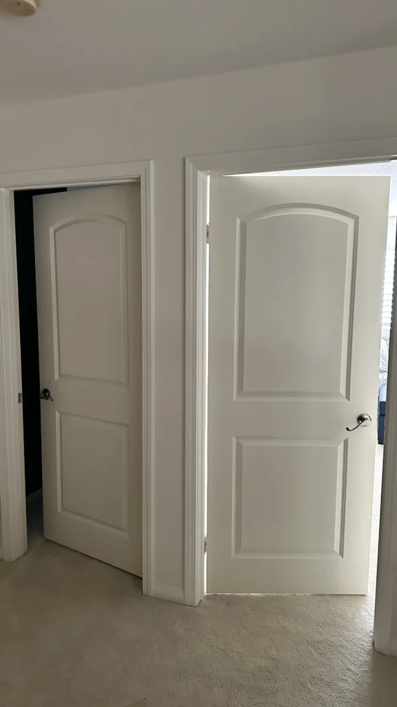 White paneled closet door installed