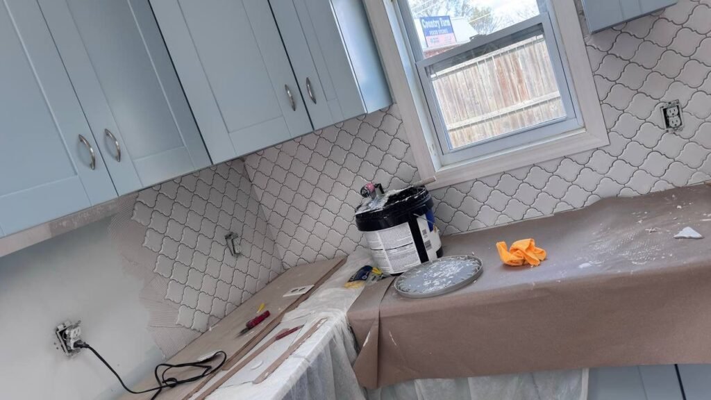 Arabesque tile backsplash with blue cabinets in Los Angeles