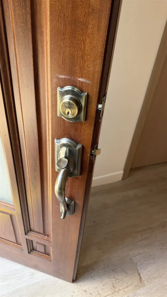 Deadbolt and handleset installed on a wood door in Los Angeles