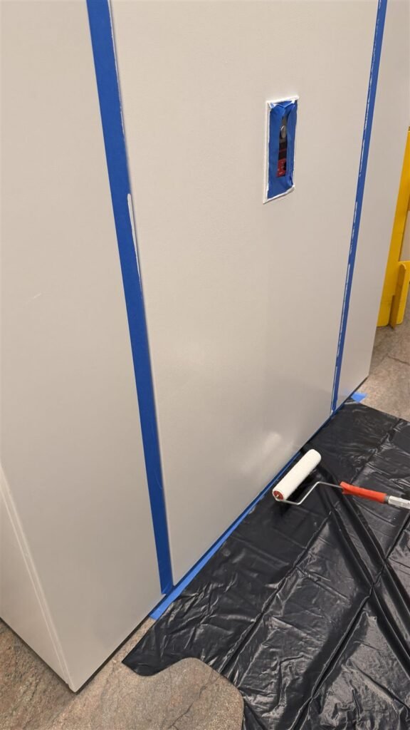 Wall masked with blue tape before painting in Los Angeles