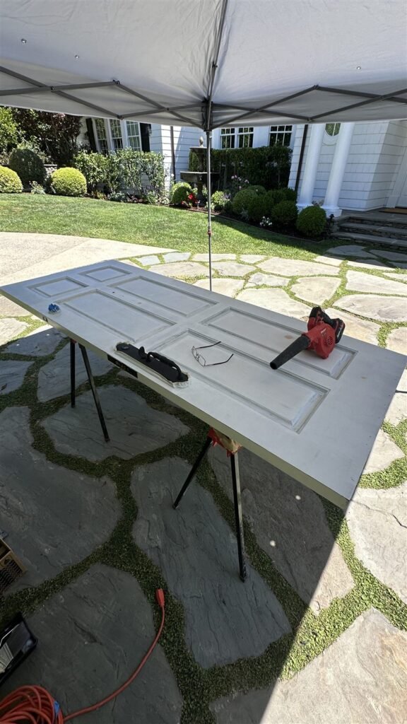 Door being painted on sawhorses in Los Angeles