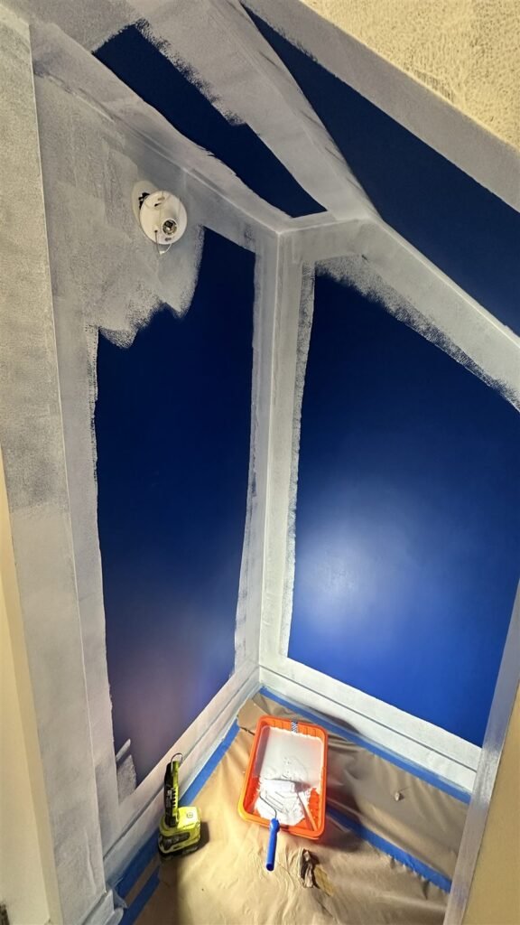 Blue accent walls being painted in a Los Angeles home