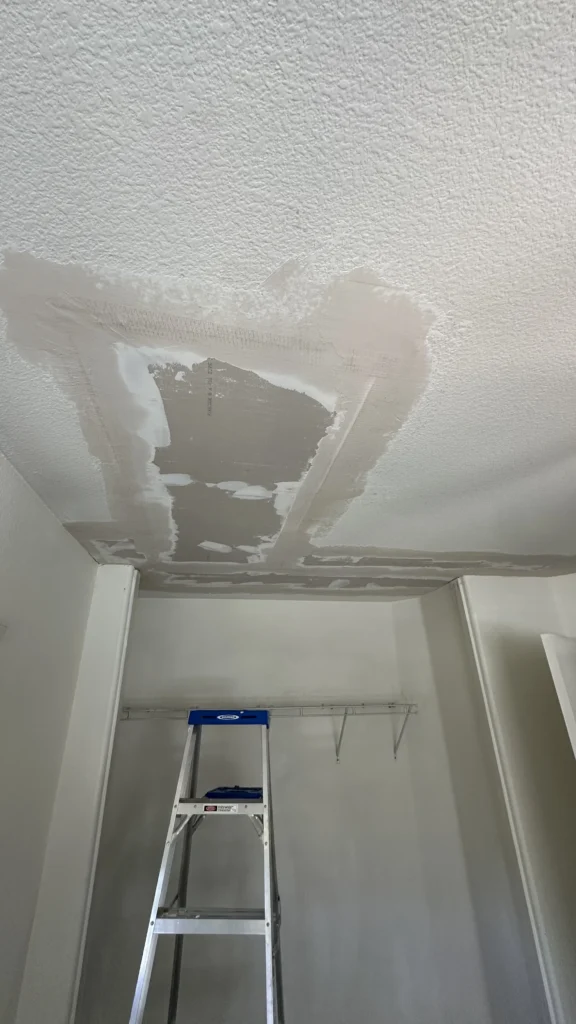Ceiling drywall patched after water damage