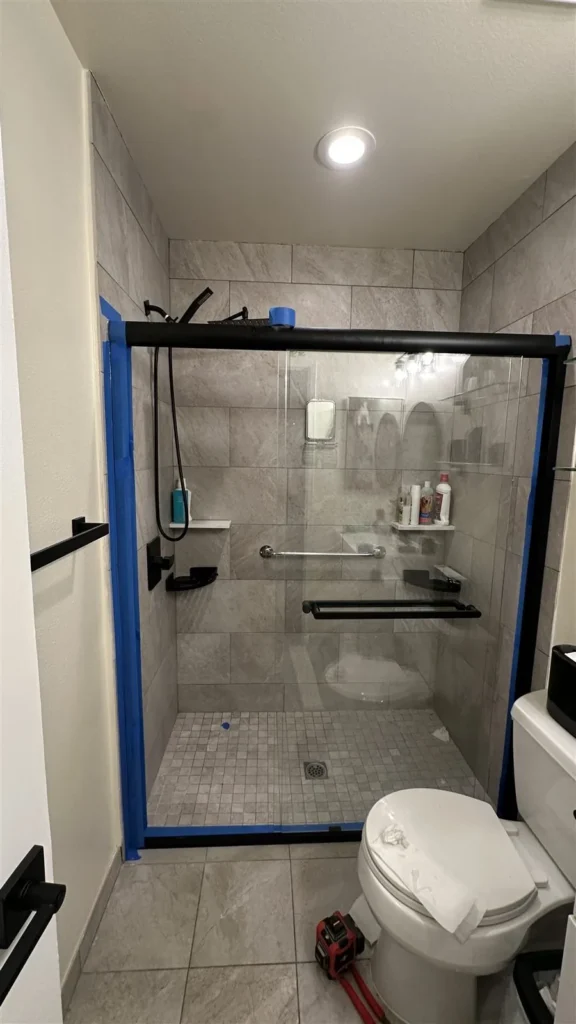 Black-framed glass shower door installed in Los Angeles