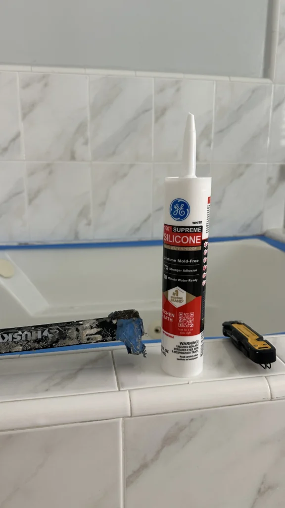Caulking tools used to reseal a tub surround in Los Angeles