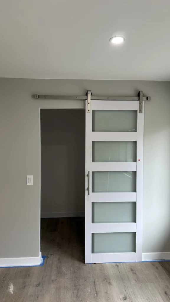 Sliding barn door installed in a hallway