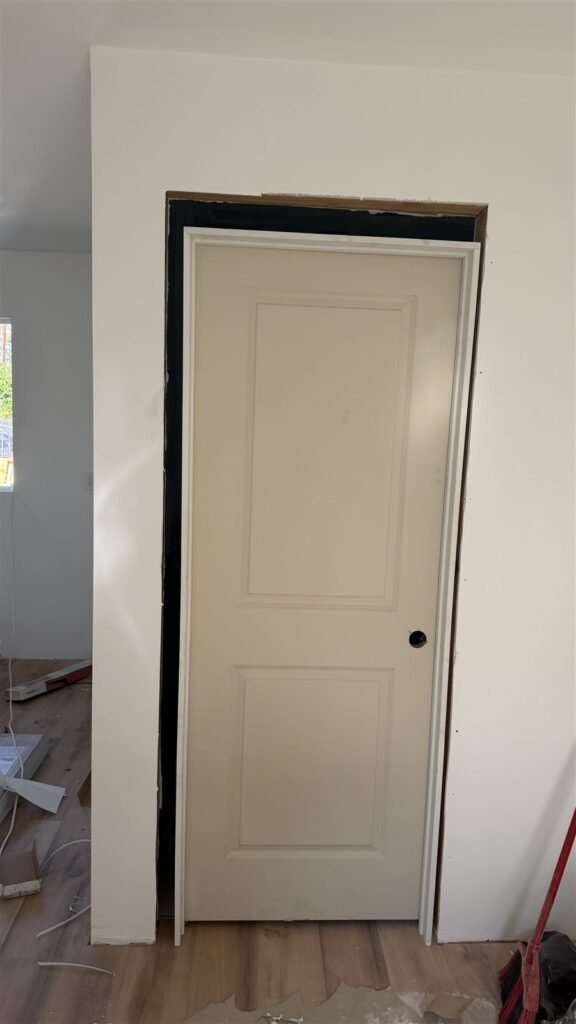 White interior door with casing installed in Los Angeles