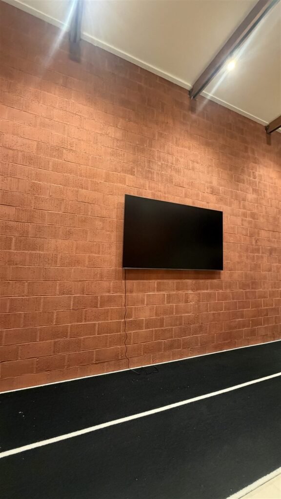 TV wall mounted on a brick wall in Los Angeles