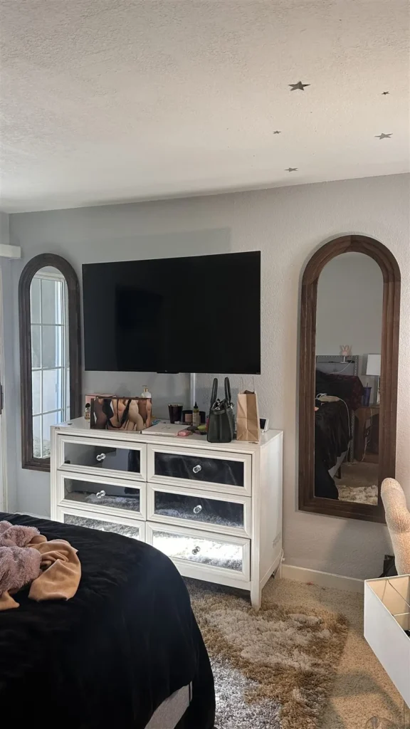 TV wall mount and mirrors in a Los Angeles bedroom
