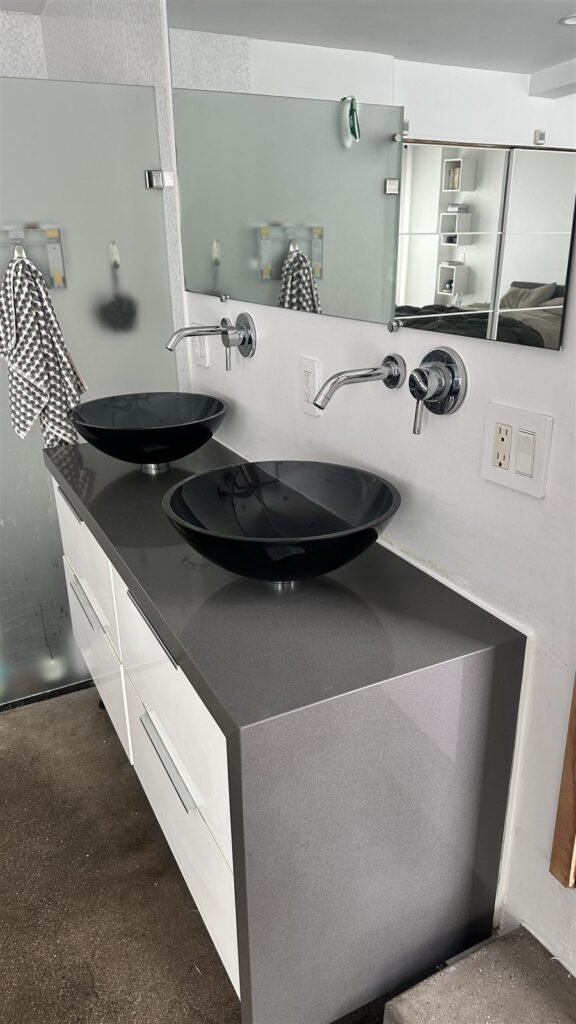 Floating vanity with vessel sinks installed in Los Angeles