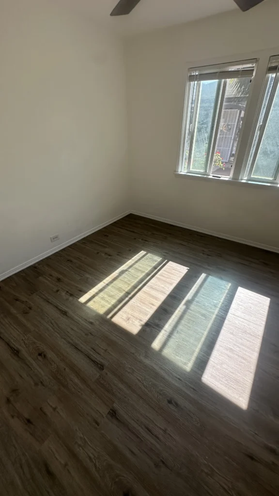 Vinyl plank flooring installed in a bedroom in a Los Angeles home