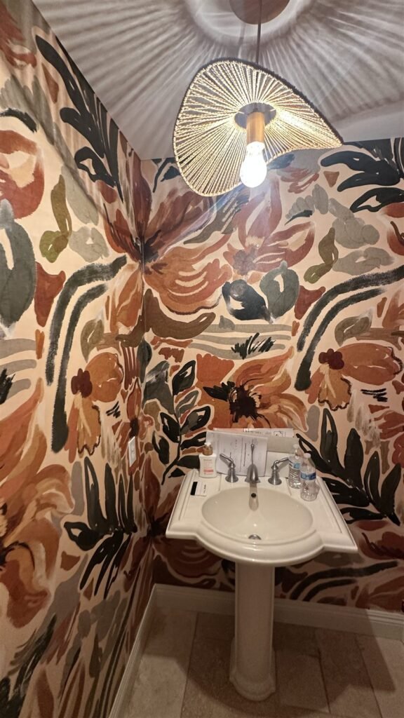 Bold tropical wallpaper mural in a Los Angeles powder room