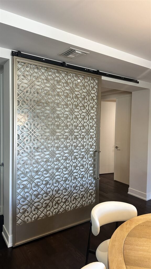 Sliding door with decorative metal panel in Los Angeles