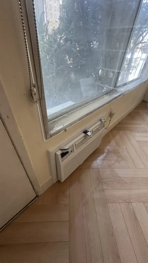Window and wood floor edge after repair in Los Angeles