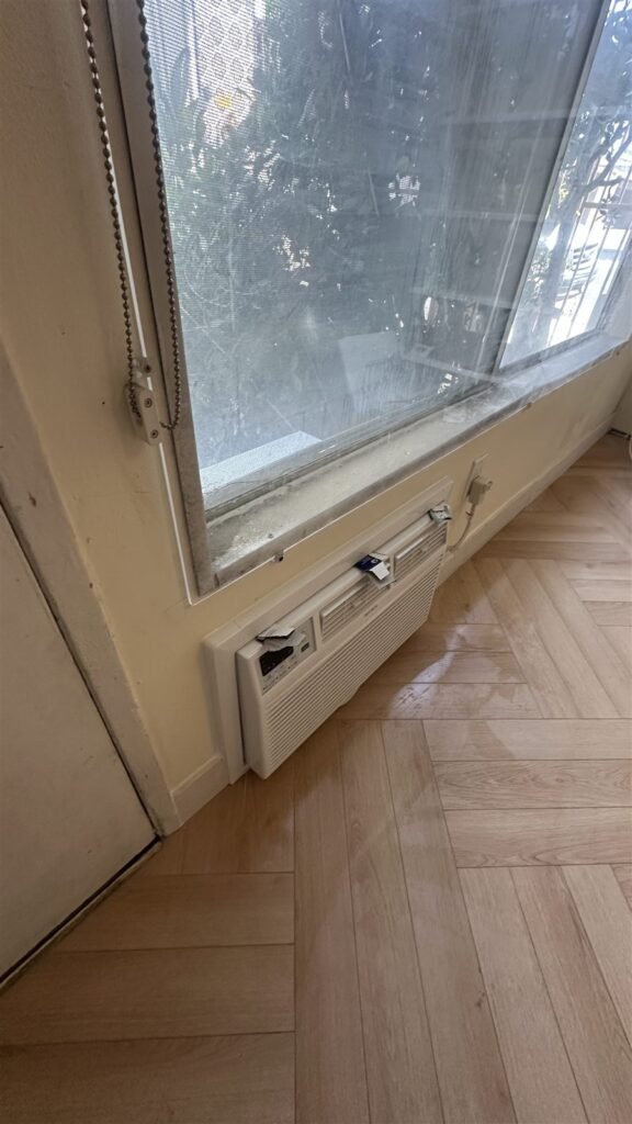 Window and wood floor edge after repair in Los Angeles