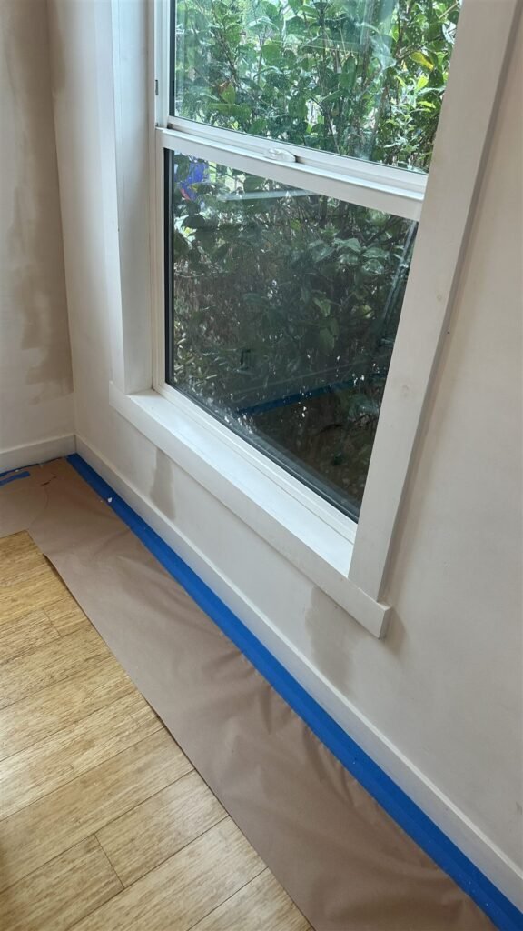 Window trim taped and painted in a Los Angeles home