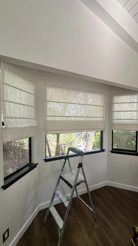 Room with new roman shades installed