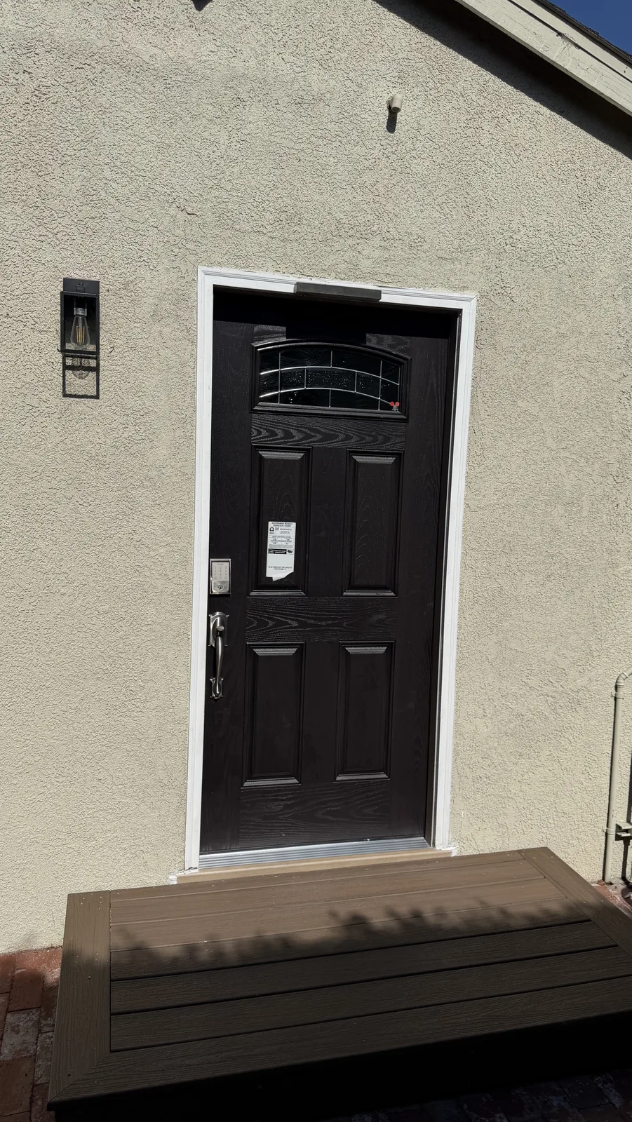 New prehung fiberglass entry door with a keypad smart lock installed by KapMorgan in Marina del Rey