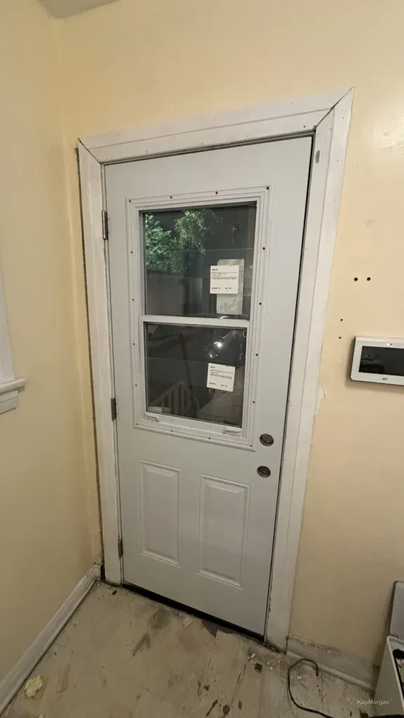 White door with window insert installed in a Los Angeles home