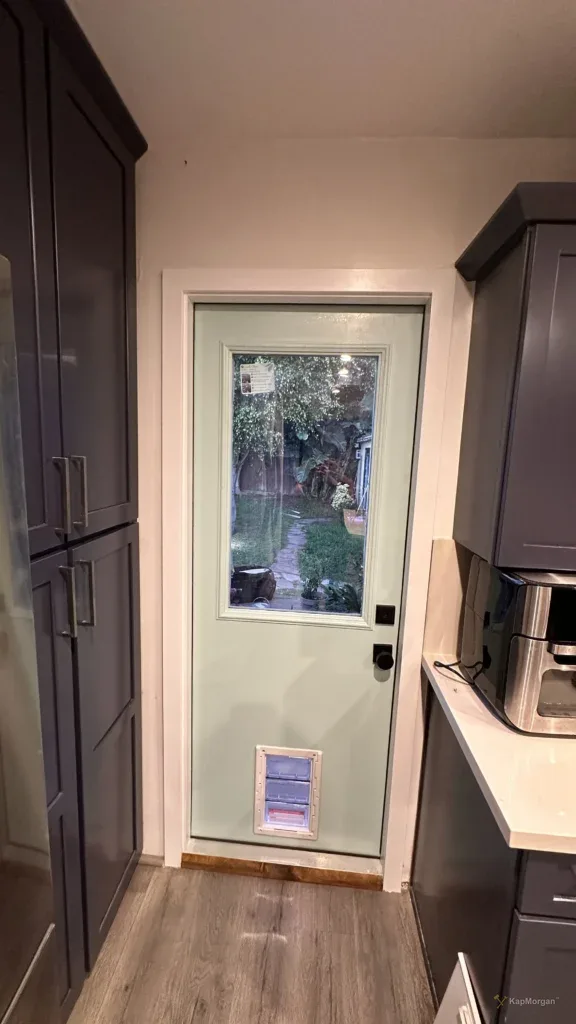 White door with window installed in a Los Angeles kitchen